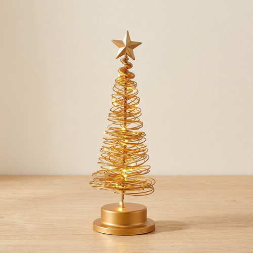 Árvore de Natal dourada com luz LED numa mesa de carvalho claro, junto a uma parede creme